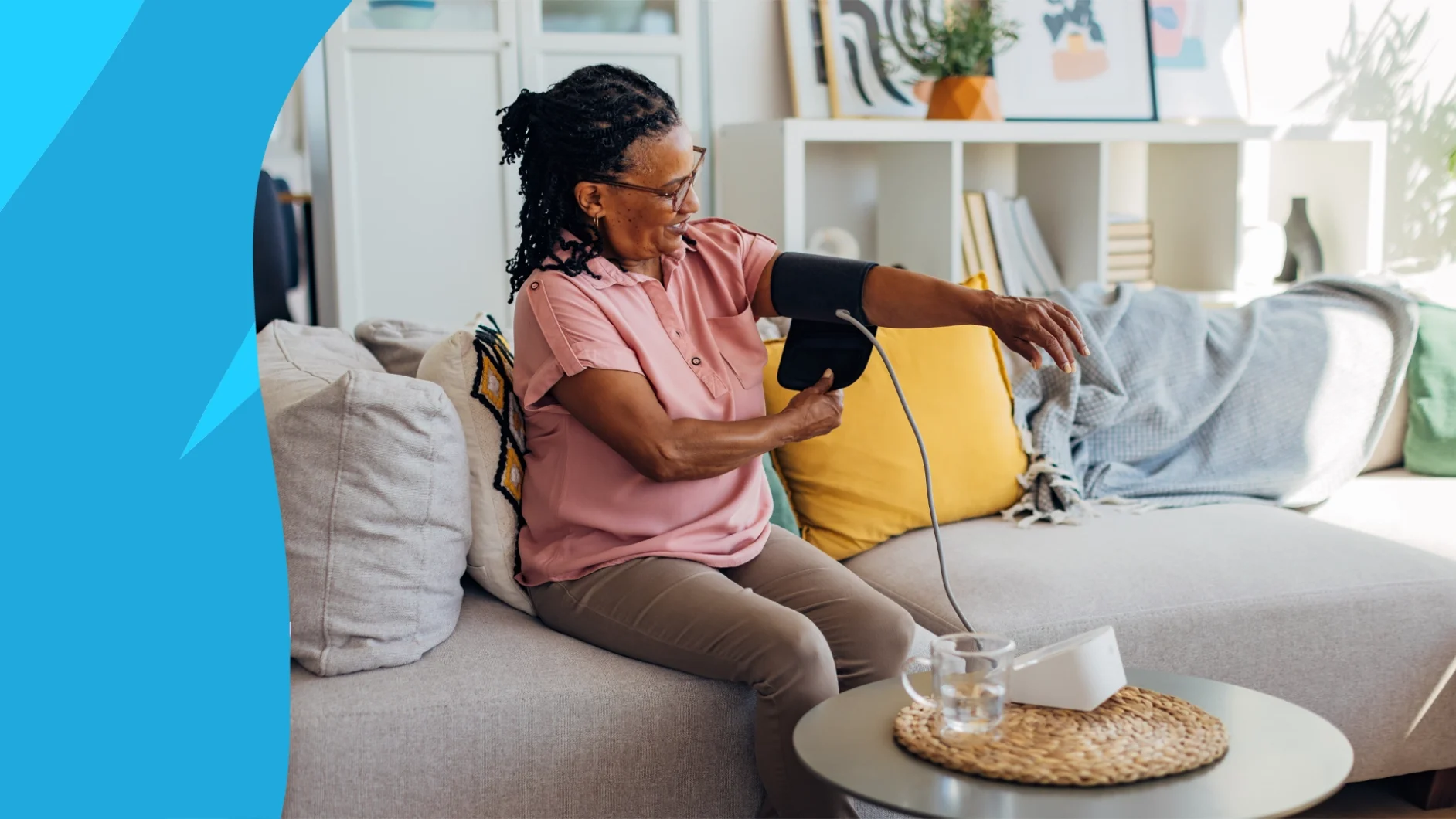 Woman checking her blood pressure at home