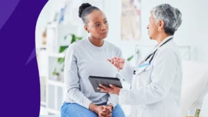 Image of a pharmacist counseling a patient to represent managing diabetes in the summer heat