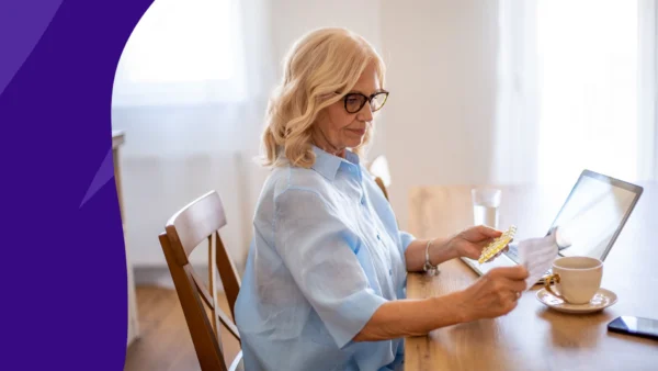 Woman with a cup of coffee and medication to represent how coffee interacts with Lexapro