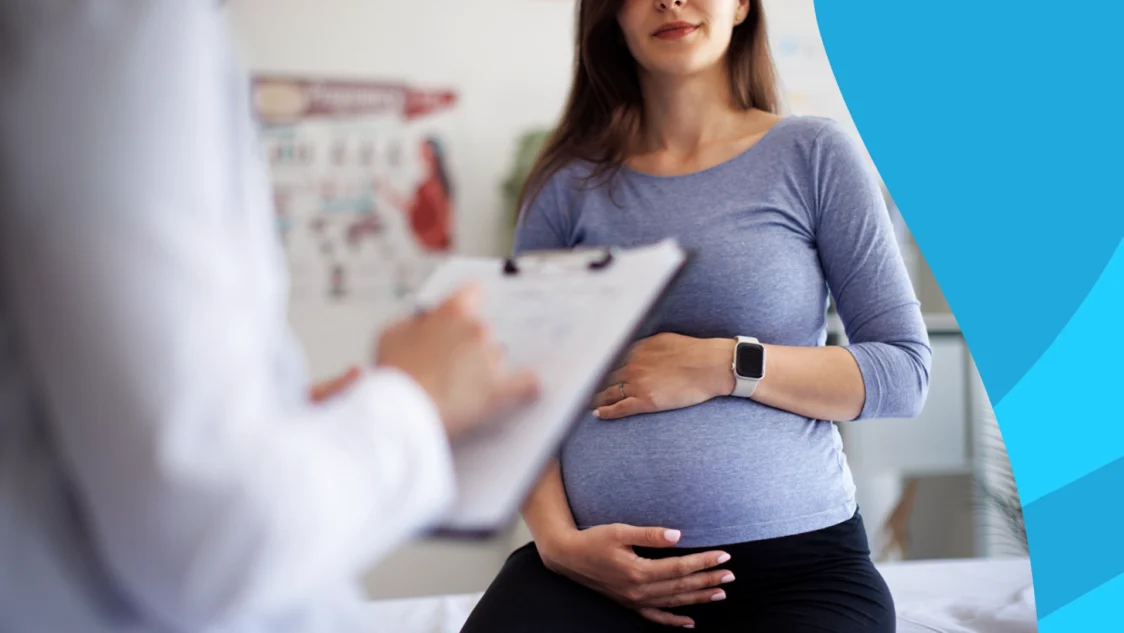 Pregnant woman speaking to a healthcare provider about the safety of Wellbutrin during pregnancy
