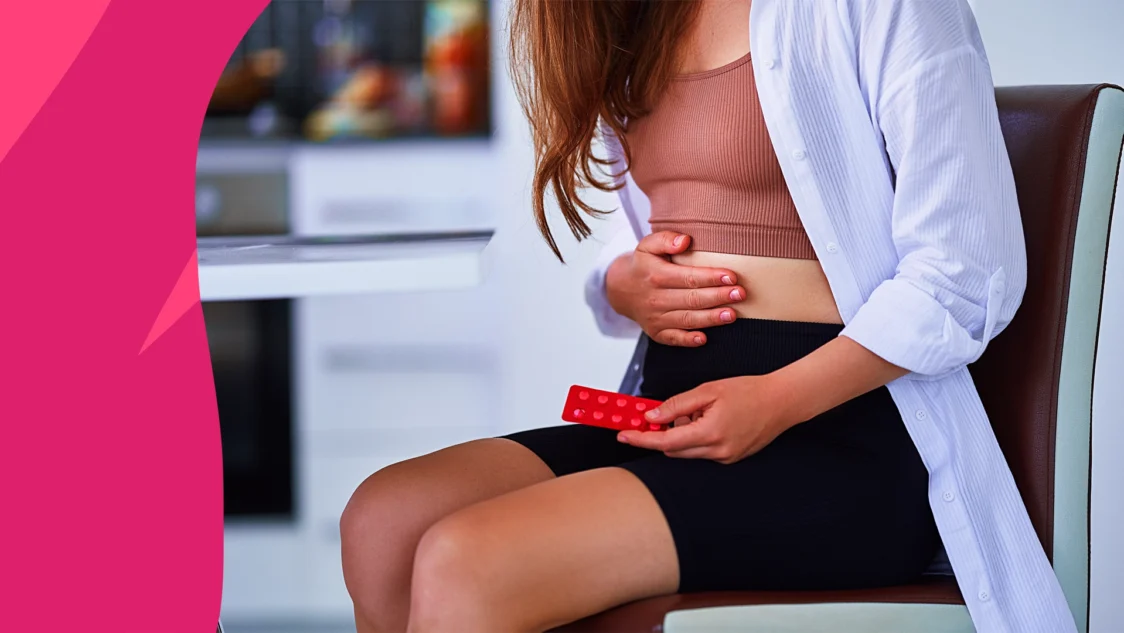 Image a woman with her hand on her abdomen to symbolize increased risk of UTIs during the summer