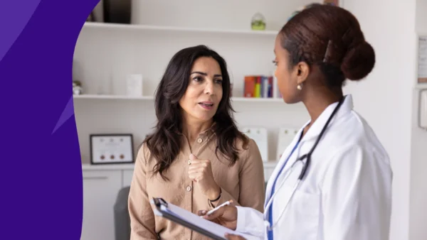 Pharmacist speaking with a patient to represent what happens if you miss a dose of lisinopril