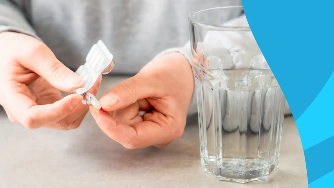 Image of a person's hands about to take a pill to represent does lexapro cause weight gain?