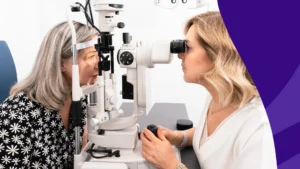 Image of an optometrist conducting a vision exam to represent eye changes after 55