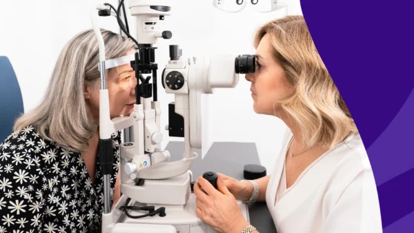 Image of an optometrist conducting a vision exam to represent eye changes after 55