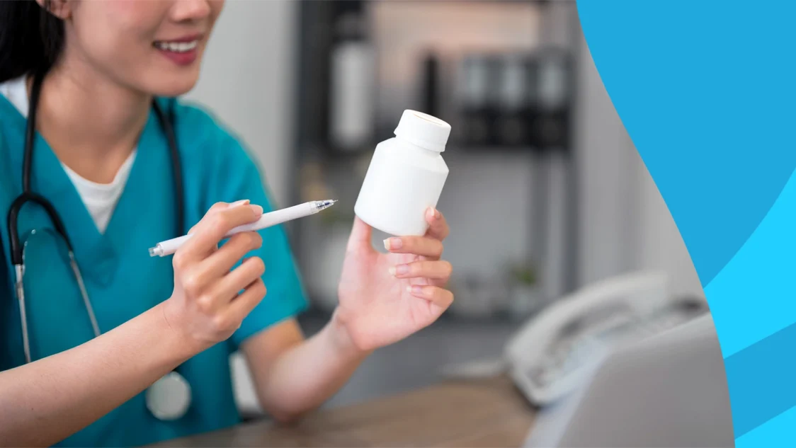Image of a pharmacist checking the price of a medication to represent how much does Auvelity cost without insurance
