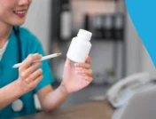Image of a pharmacist checking the price of a medication to represent how much does Auvelity cost without insurance