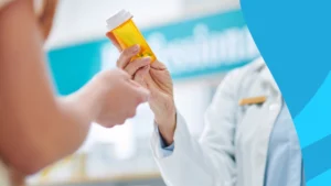 Image of a pharmacist handing a patient a prescription to represent Calypta cost without insurance